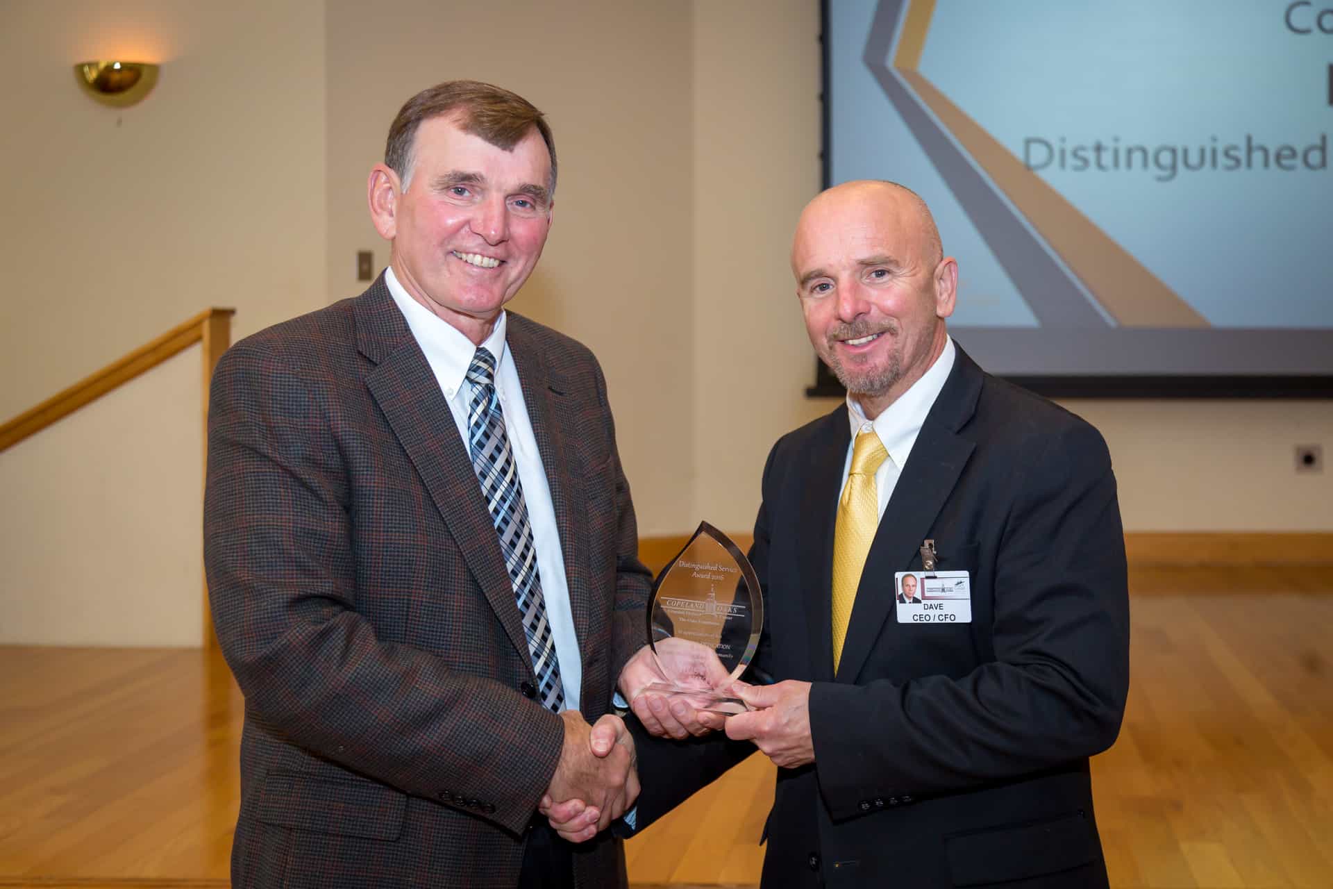 Rusty Kiko receives Distinguished Service Award from Dave Mannion