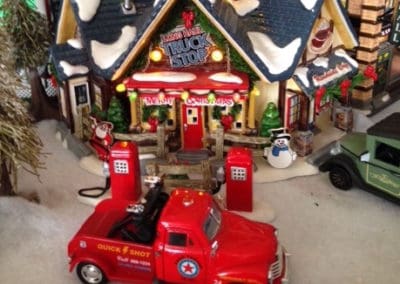 Christmas village truck shop and truck figurines