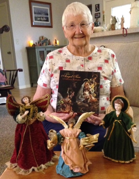 Irma poses with three of her angels.