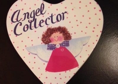 Irma's angel box that has a paper heart with an angel on it that says "Angel Collector"