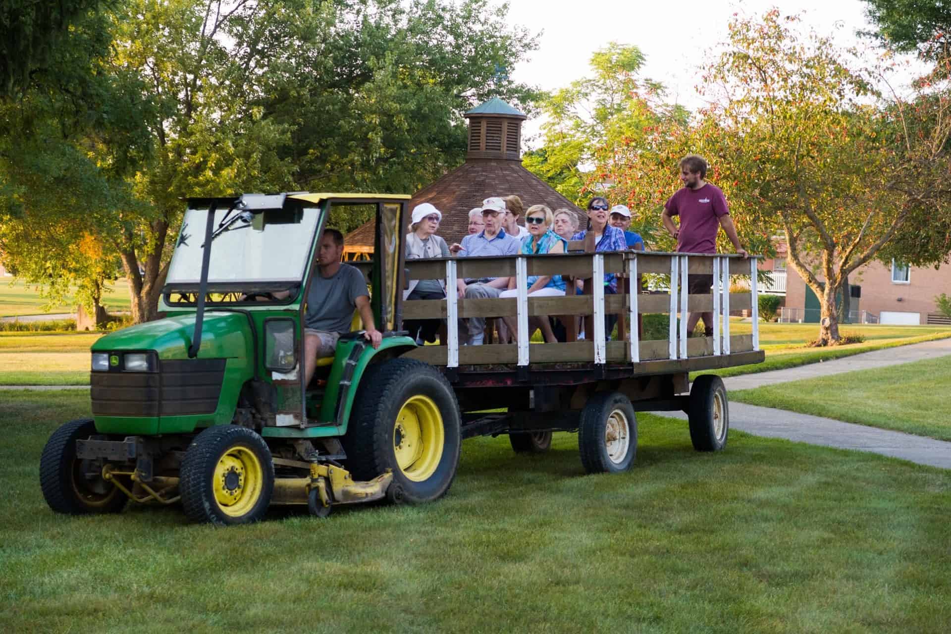 Elderly people taking a wagon ride